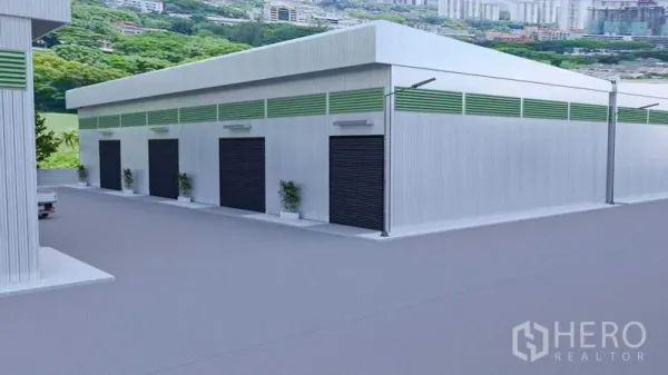 Warehouse for rent in Bang Phli, Samut Prakan - Side view of the warehouse showing several loading bay doors and generous truck circulation space.