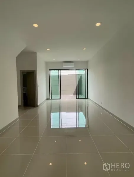 Home Office for rent in Bueng Kum, Bangkok - Open-plan ground floor with glossy tiles, recessed lighting, and sliding doors to the courtyard.