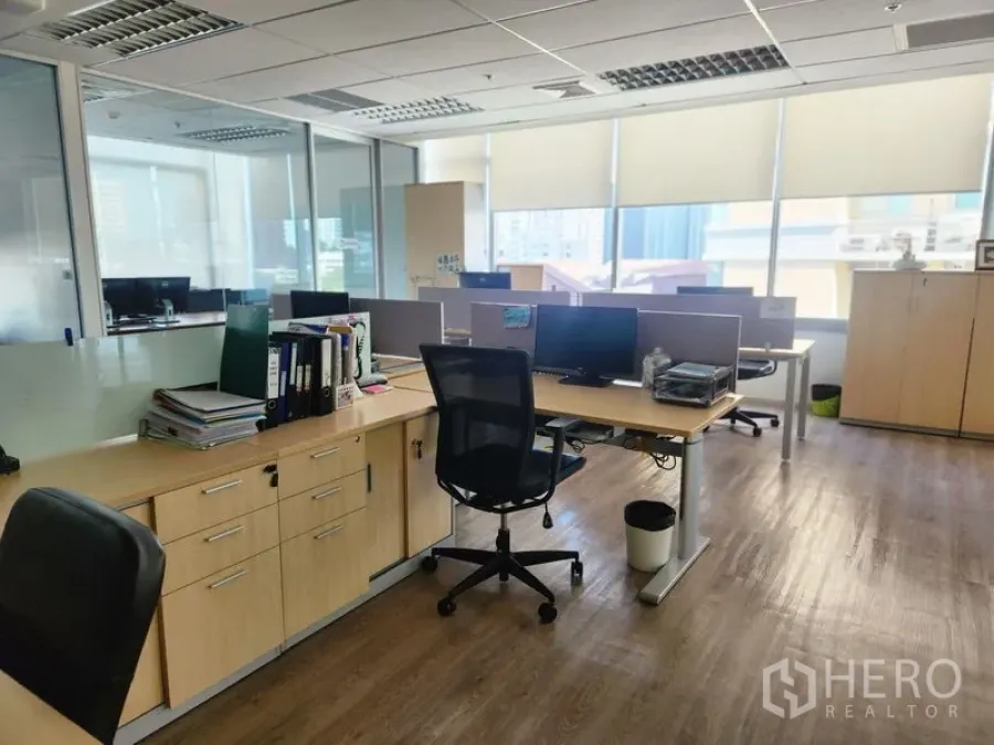 Office Space for rent in Watthana, Bangkok - Work area featuring storage cabinets, desks and large windows filling the space with daylight.