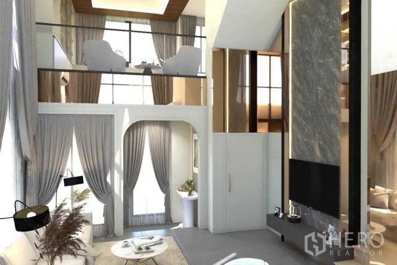 Townhouse for sale in Suan Luang, Bangkok - Loft mezzanine overlooking the living room with tall curtains.