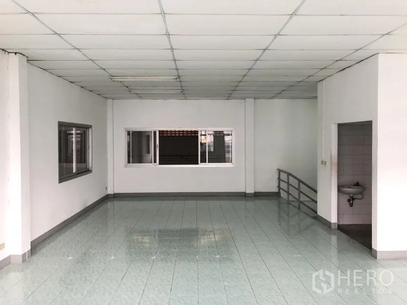 Factory for rent in Pathum Thani - Upstairs office space with internal window to warehouse and nearby washroom.