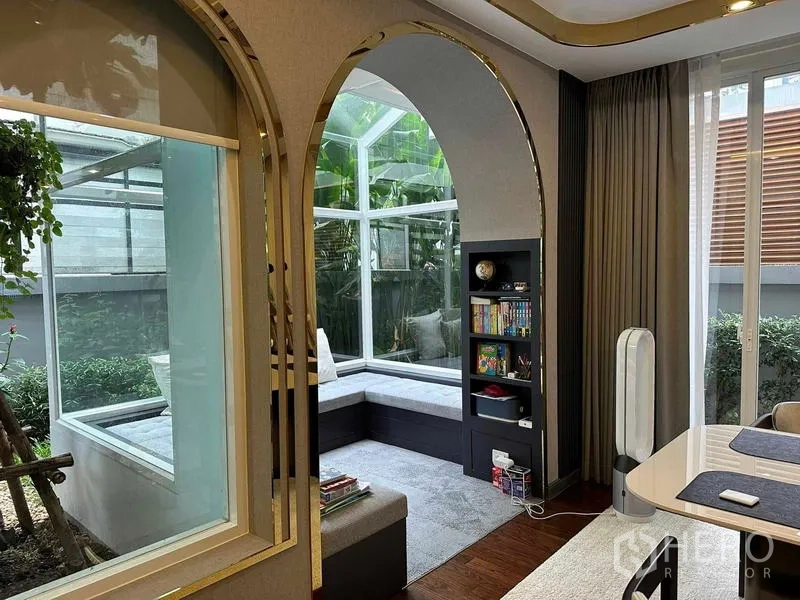Detached House for sale in Suan Luang, Bangkok - Bright conservatory-style bay window nook with garden view and arched trims.