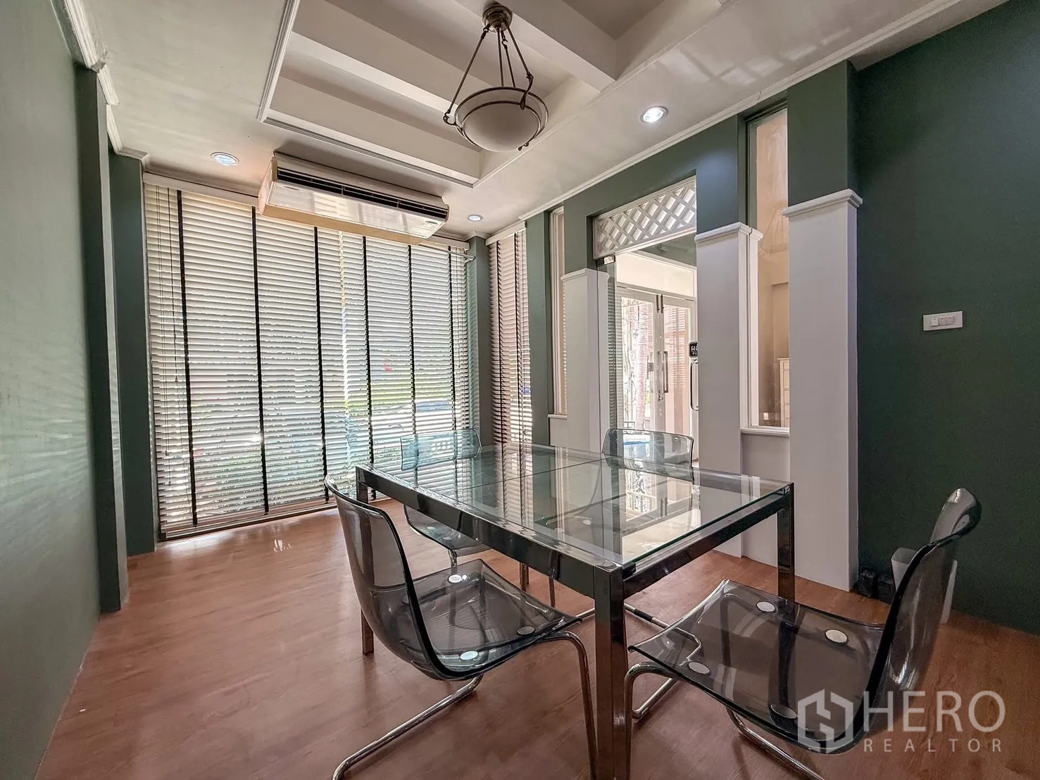 Home Office for rent in Wang Thonglang, Bangkok - Glass-partition meeting room with table, chairs and full-height blinds.