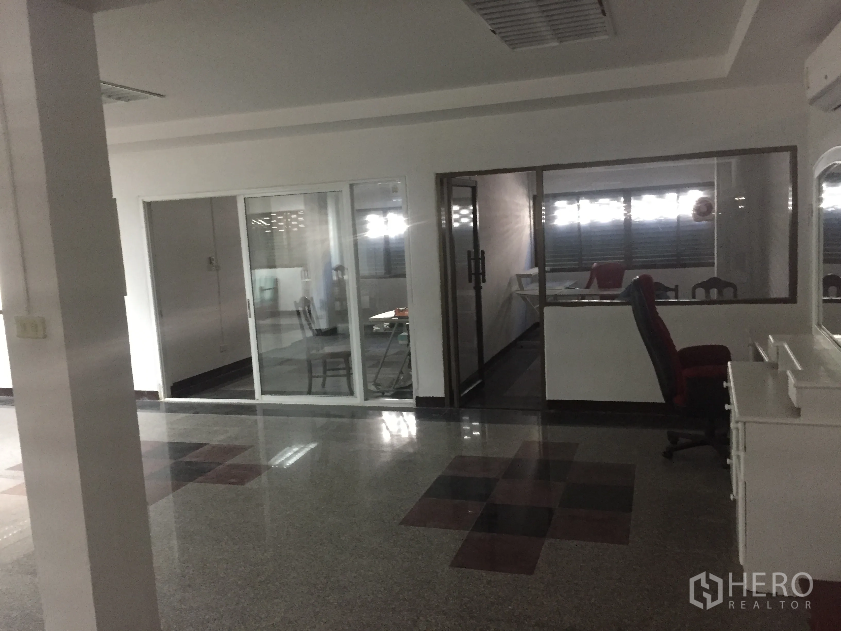Home Office for rent in Watthana, Bangkok - Glass sliding doors leading to meeting rooms and workstations inside the office zone.