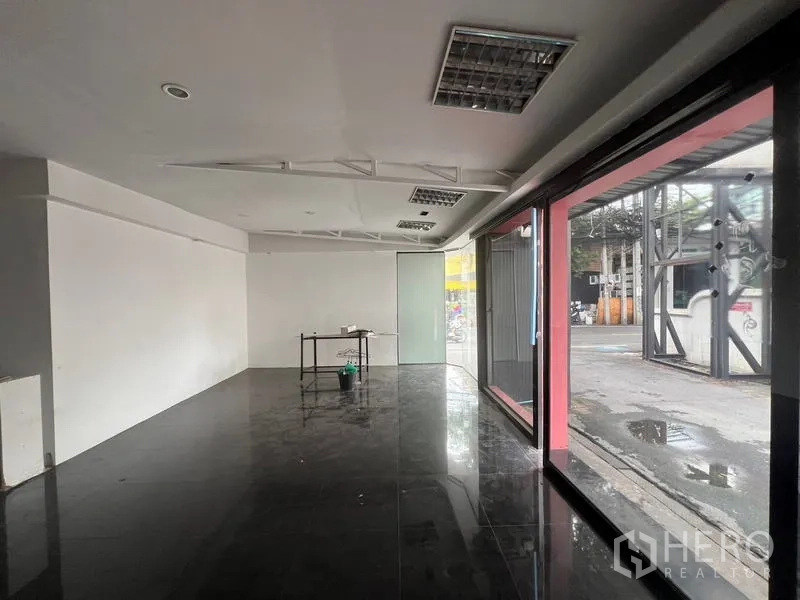 Retail Space for rent in Watthana, Bangkok - Interior view toward full-height streetfront windows offering strong visibility to passing traffic.