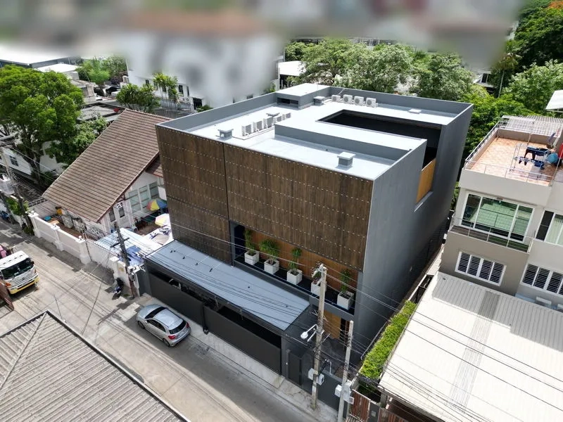 Detached House for rent or sale in Bangkok - Aerial view of contemporary box-shaped home with rooftop equipment and central courtyard void.