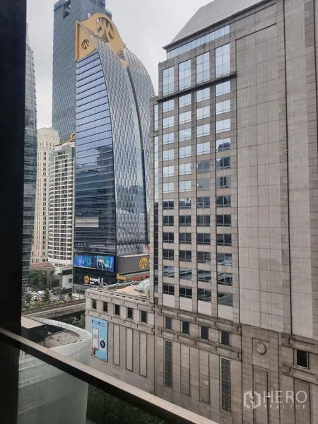 Condominium for rent in Pathum Wan, Bangkok - Central Bangkok skyline view from the condo window with contemporary office towers.