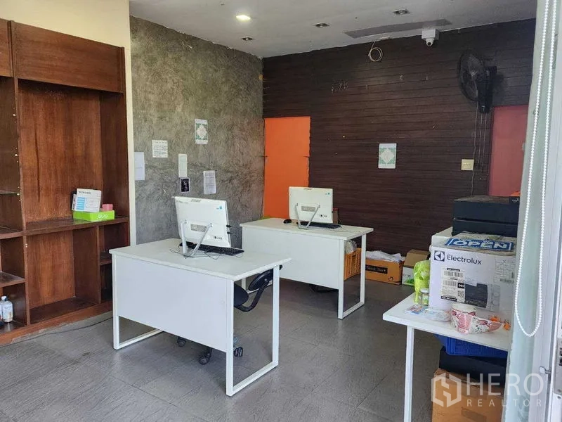 Warehouse for rent in Lat Phrao, Bangkok - Second office area with workstations, wood shelving and equipment.