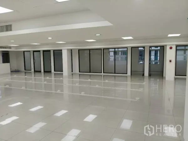 Office Space for rent in Chatuchak, Bangkok - Spacious office area with multiple frosted glass doors and polished tile flooring