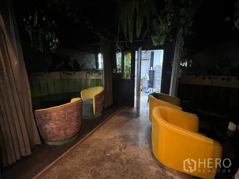 Retail Space for rent in Watthana, Bangkok - Semi-private booth with yellow armchairs and a curved banquette near the doorway.