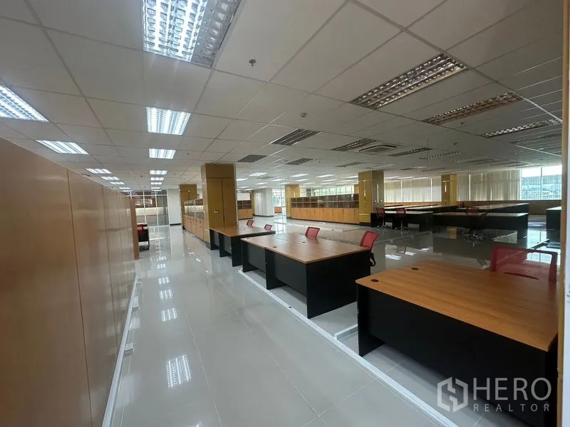 Office Space for rent in Suan Luang, Bangkok - Expansive open workspace with rows of wooden desks and tiled floors