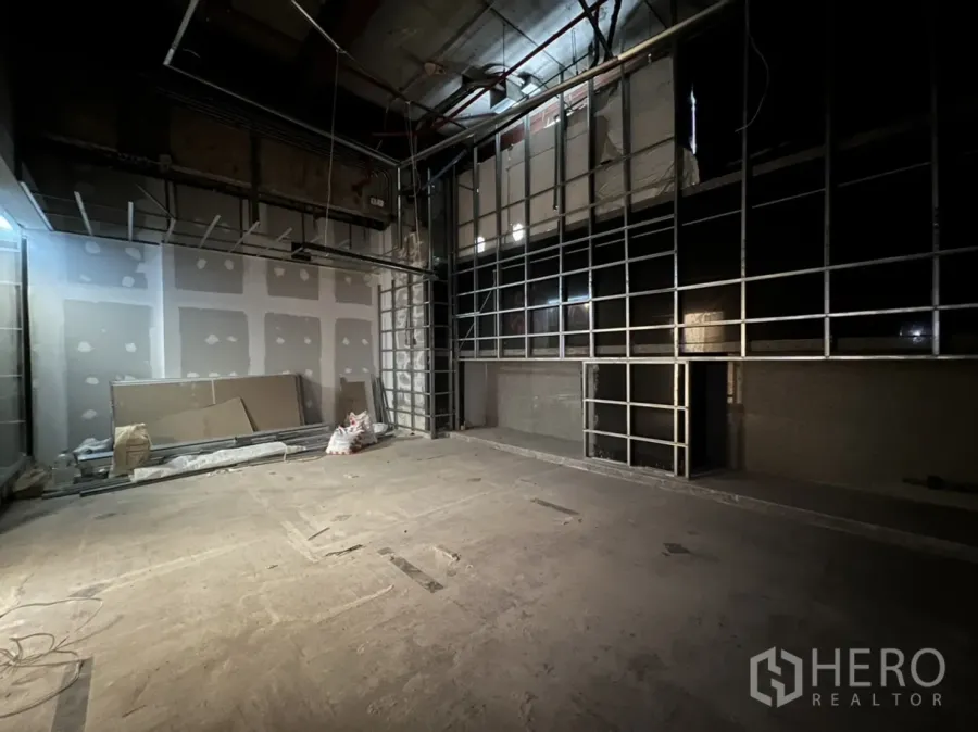 Retail Space for rent in Watthana, Bangkok - Empty shop under renovation with metal wall framing and open ceiling.