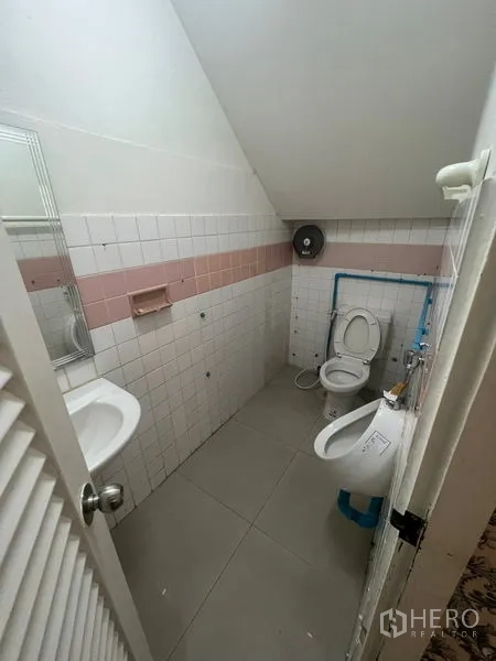 Retail Space for rent in Watthana, Bangkok - Compact restroom with toilet, urinal and sink.