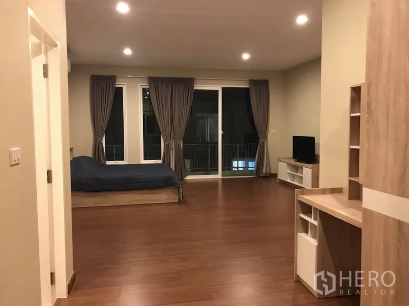 Detached House for rent or sale in Bang Na, Bangkok - Master suite view with work desk, TV cabinet and balcony access.