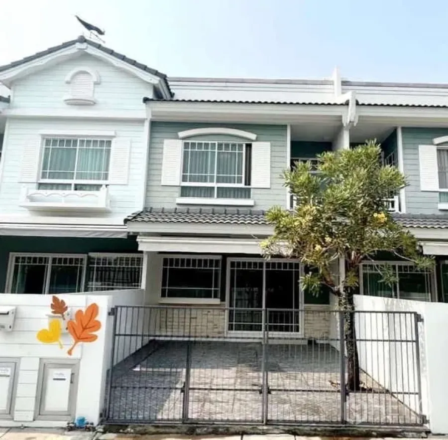 Detached House for rent in Bang Phli, Samut Prakan - Front view of the house showing gated driveway and shuttered upstairs windows.