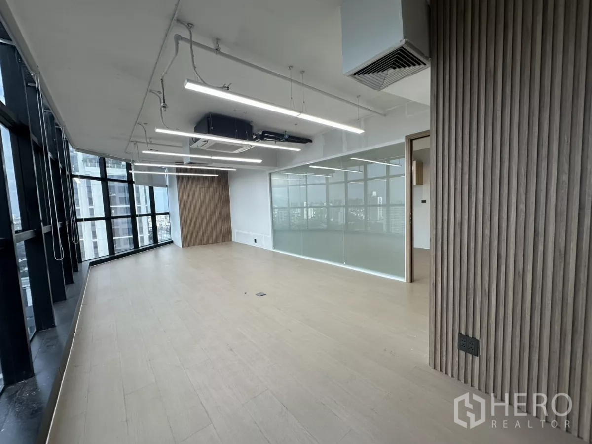 Office Space for rent in Watthana, Bangkok - Bright meeting space with slatted column and glass wall enclosure.