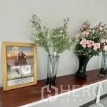 Home Office for rent in Wang Thonglang, Bangkok - Close-up of decorative console with vases and framed picture.