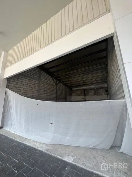 Retail Space for rent in Khlong Toei, Bangkok - Ground-floor shop unit with large opening and partial fabric cover, ready for custom fit-out.