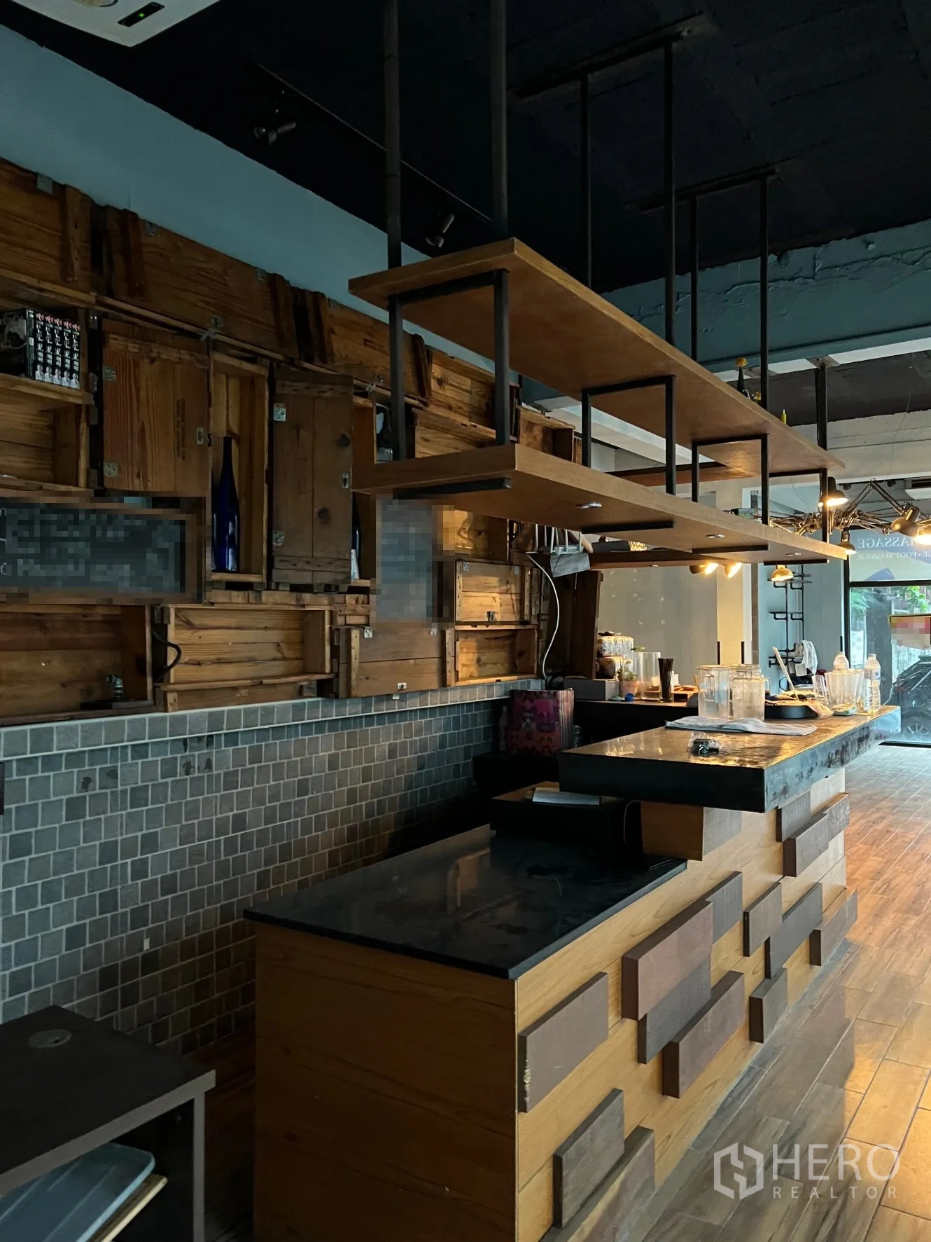 Retail Space for rent in Watthana, Bangkok - Bar-style service counter with hanging shelves, tile backsplash and wood accents.
