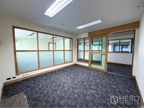 Office Space for rent in Bang Rak, Bangkok - Private meeting room with sliding glass door and frosted glass panels.
