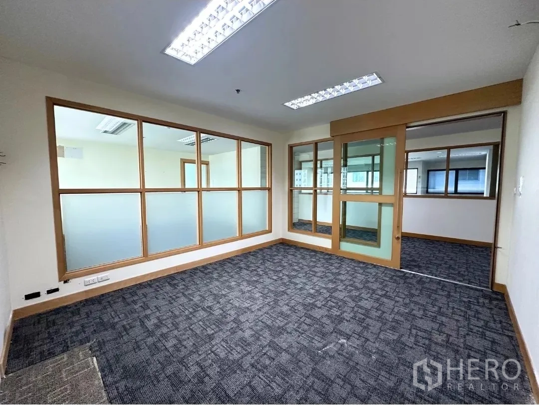 Office Space for rent in Bang Rak, Bangkok - Private meeting room with sliding glass door and frosted glass panels.