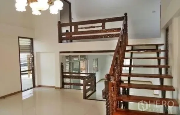 Office Space for rent in Chatuchak, Bangkok - Split-level space featuring a wooden staircase, mezzanine and chandelier lighting.