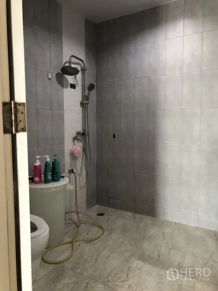 Detached House for sale in Lam Luk Ka, Pathum Thani - Walk-in shower bathroom with gray wall tiles.