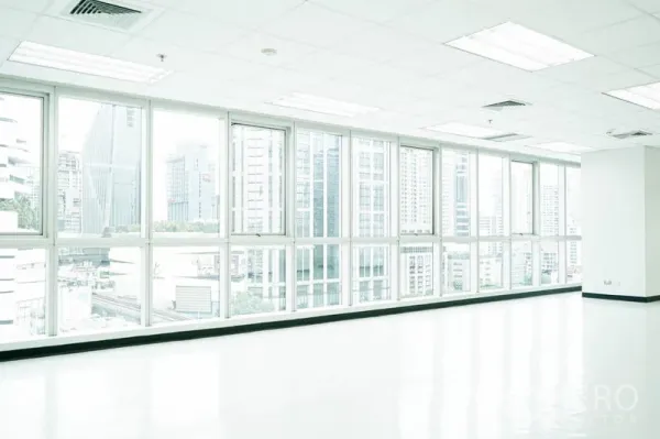Office Space for rent in Watthana, Bangkok - Bright corner office with floor-to-ceiling windows and Bangkok skyline views.