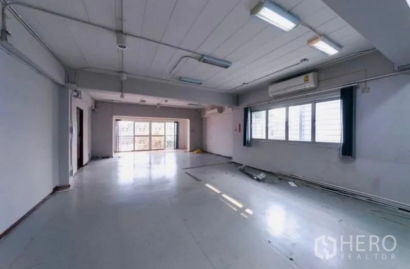 Home Office for rent or sale - Open office level with wide windows and sliding doors bringing in natural light.