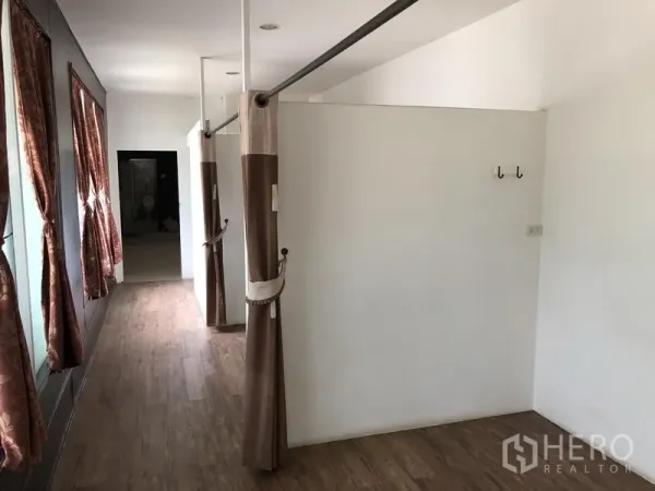 Retail Space for rent in Khlong Toei, Bangkok - Partitioned fitting or treatment bays with curtains, wood flooring and side windows.