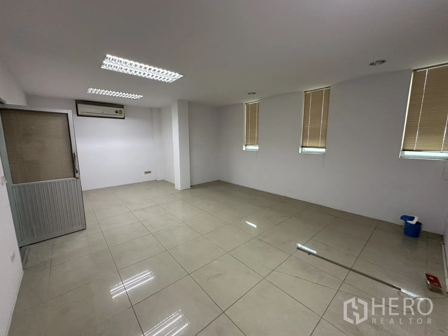 Factory for rent - Bright bedroom with wardrobe, split-type AC, and balcony door.