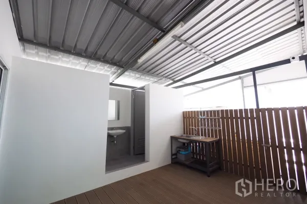 Office Space for rent in Khlong Toei, Bangkok - Covered utility terrace with stainless sink, wood privacy screen and access to restroom.