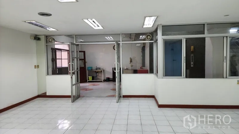 Office Space for rent or sale in Khlong Toei, Bangkok - Office space with sliding glass doors opening to a utility or back area.