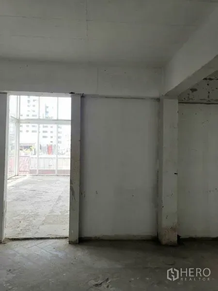 Retail Space for rent in Watthana, Bangkok - Partitioned room opening to a bright area with large glass doorway.