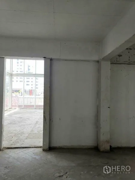 Retail Space for rent in Watthana, Bangkok - Partitioned room opening to a bright area with large glass doorway.