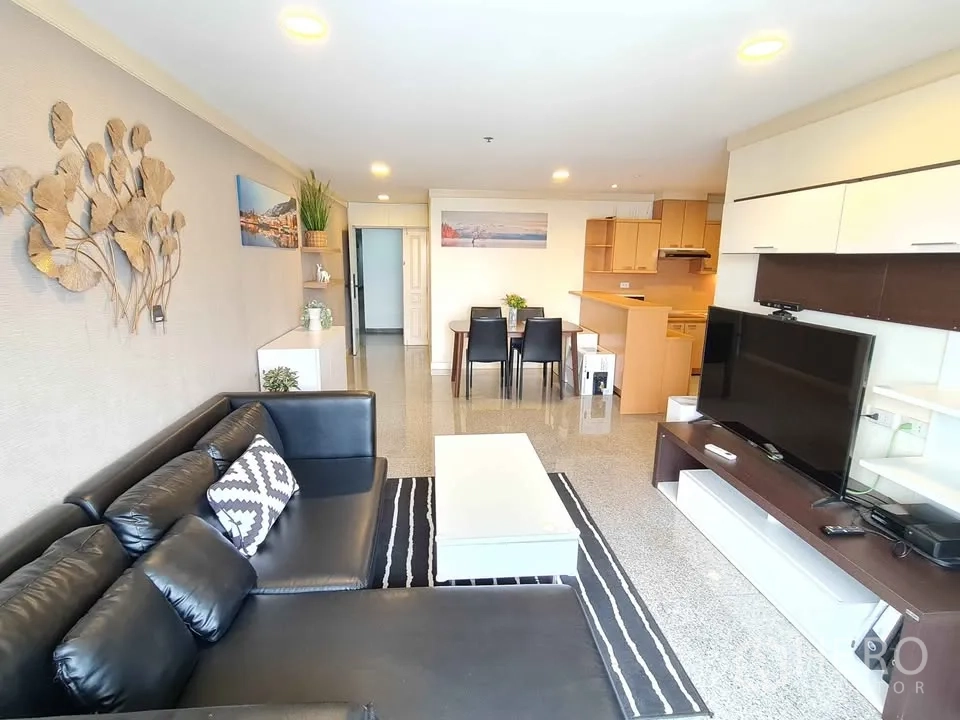 Condominium for rent in Khlong Toei, Bangkok - Compact kitchen featuring stainless refrigerator and ample cabinetry.