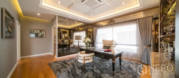 Detached House for rent in Prawet, Bangkok - Grand study room with mirrored walls, display shelving and a luxurious area rug