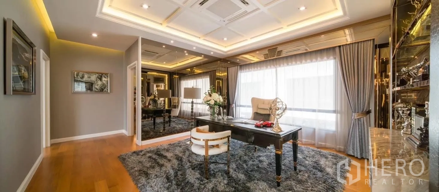 Detached House for rent in Prawet, Bangkok - Grand study room with mirrored walls, display shelving and a luxurious area rug