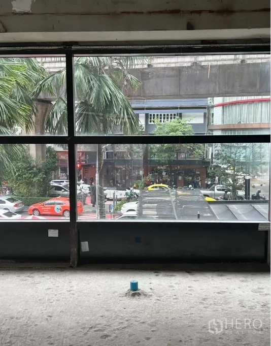 Retail Space for rent - Large storefront window with city and traffic view toward Sukhumvit and the BTS line.