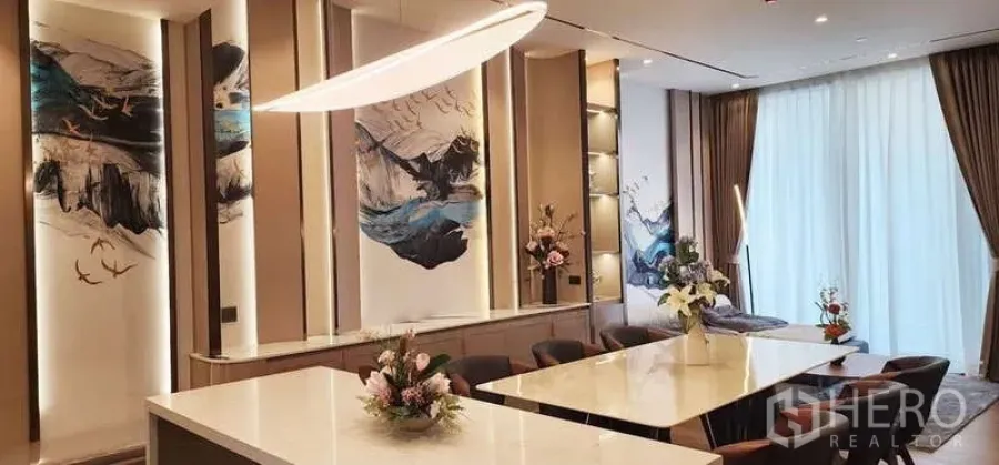 Condominium for rent - Elegant dining area with long island table, designer lighting and art wall panels.
