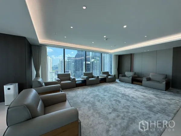 Office Space for rent in Din Daeng, Bangkok - Large meeting lounge with armchairs arranged by floor-to-ceiling windows.