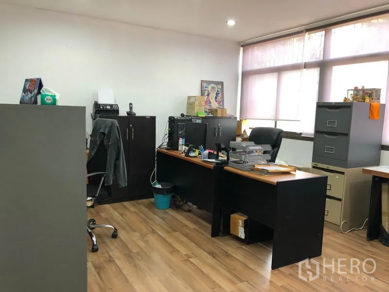 Warehouse for rent in Chatuchak, Bangkok - Private office with wood flooring, large windows and filing cabinets.