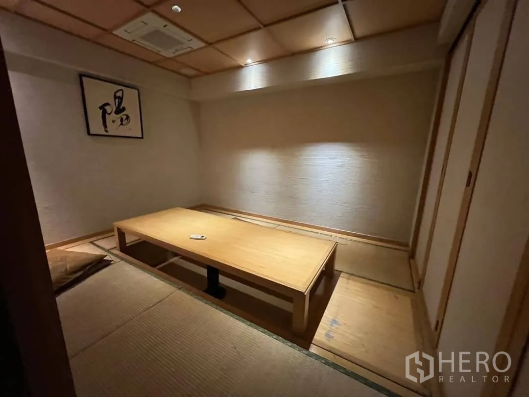 Retail Space for rent - Private tatami dining room with low table and recessed floor seating, soft downlights.