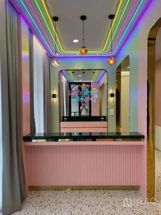 Detached House for rent in Phaya Thai, Bangkok - Colorful home bar with neon lighting, pastel cabinetry and pendant lamps.
