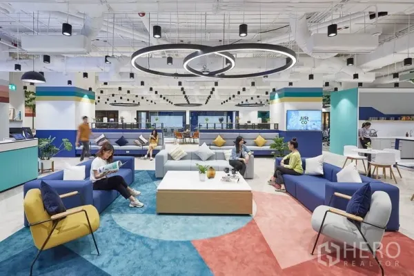 Office Space for rent in Pathum Wan, Bangkok - Bright lounge with modular sofas, circular pendant lights and a reception-style counter.