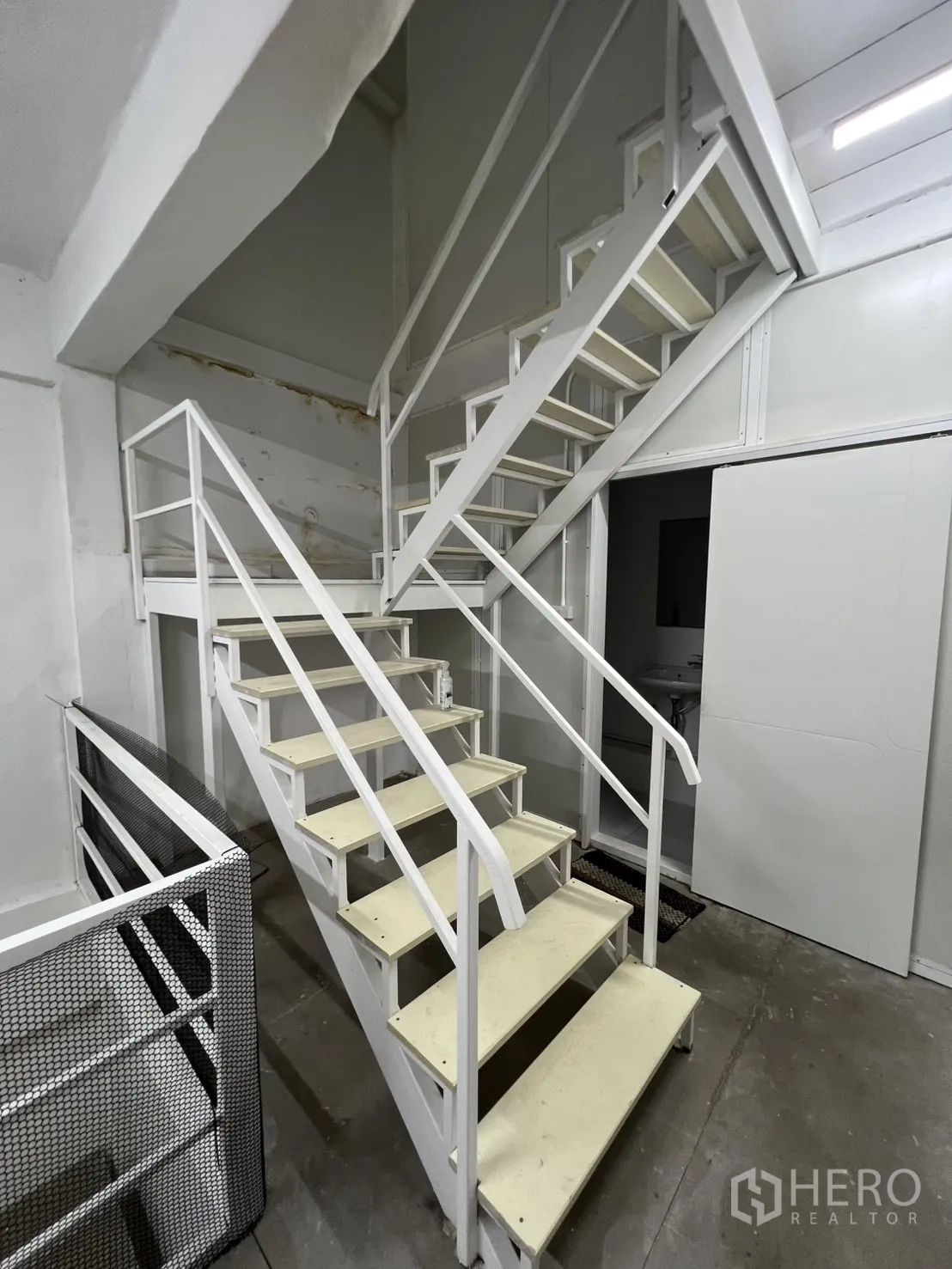 Shophouse for rent or sale in Khlong Toei, Bangkok - Sturdy white steel stairs connecting multiple floors.