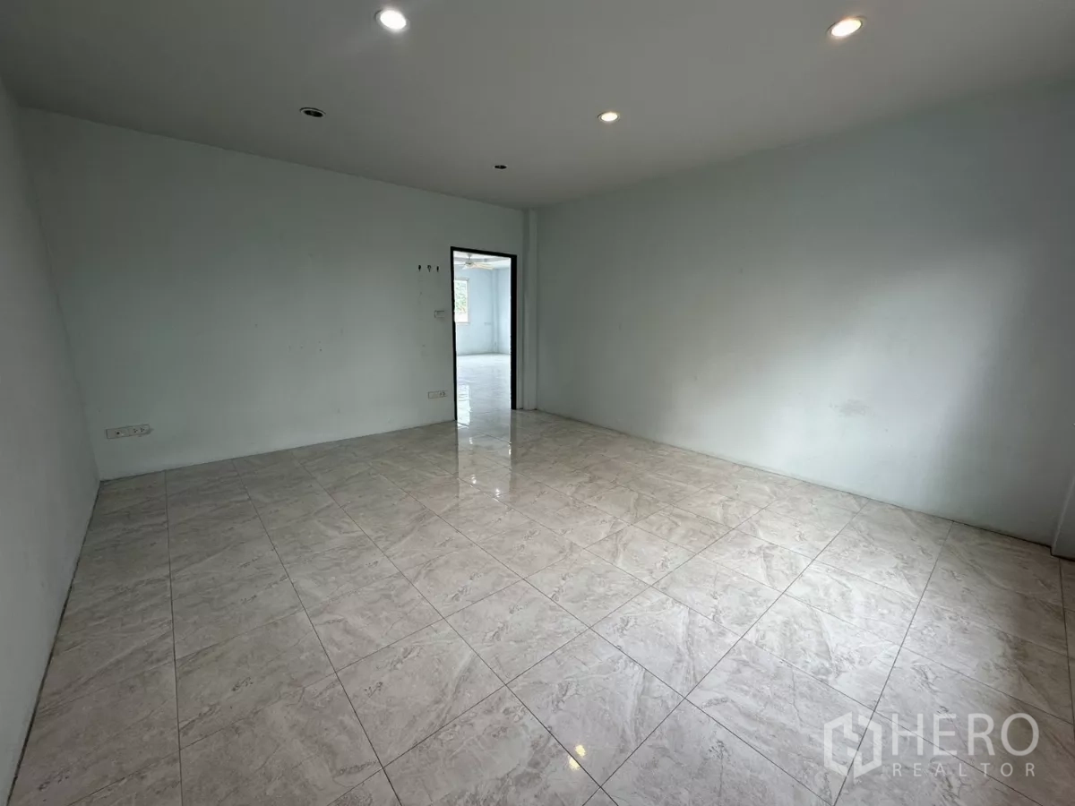 Home Office for rent - Empty bedroom with tiled flooring, recessed lights and neutral walls.