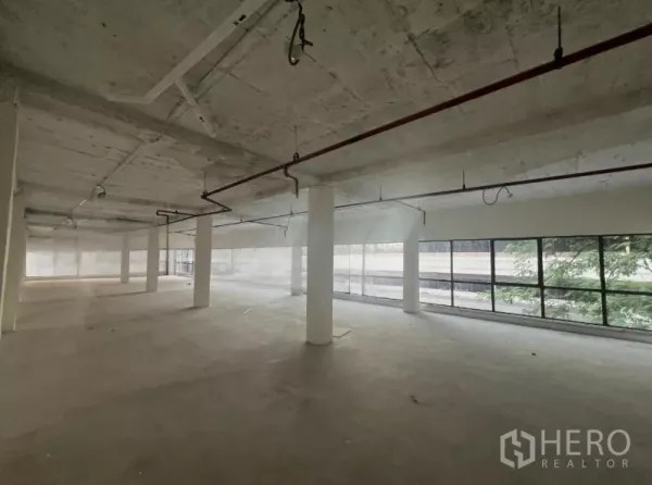 Retail Space for rent in Watthana, Bangkok - Open retail space with a long run of street-facing windows.