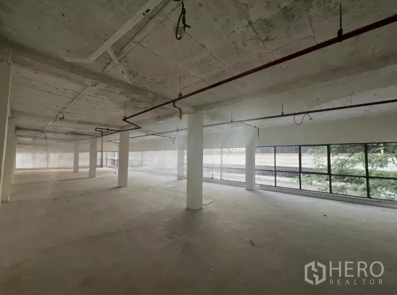 Retail Space for rent in Watthana, Bangkok - Open retail space with a long run of street-facing windows.