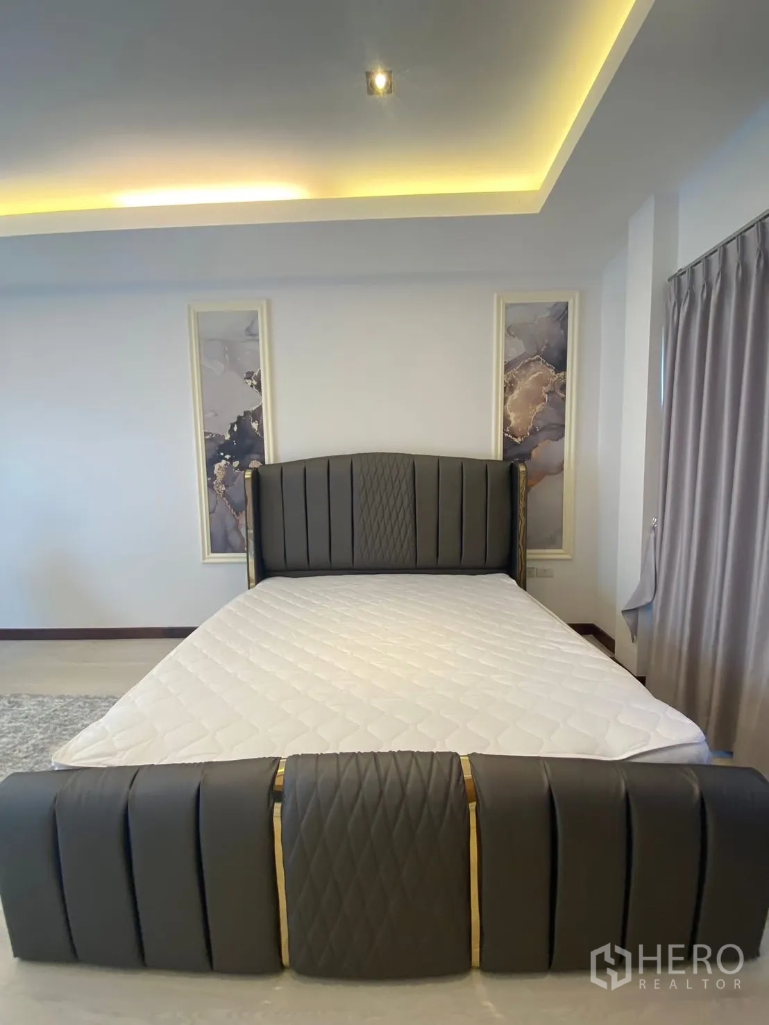 Detached House for rent in Suan Luang, Bangkok - Bedroom view showing statement headboard and ceiling lighting.